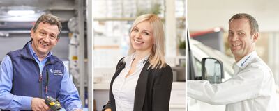 Drei Mitarbeiter bei Auto Röhr in freundlicher Arbeitsumgebung.